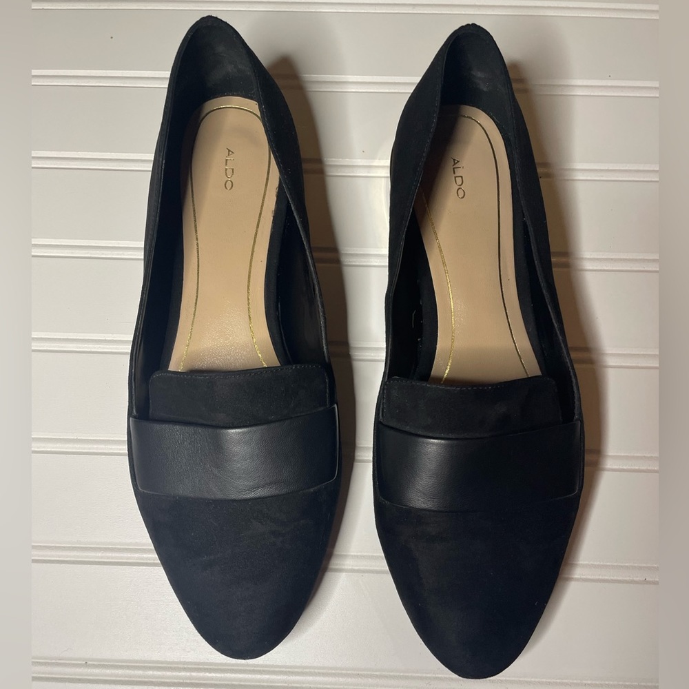 Aldo black flats with gold heel. Size 9.
